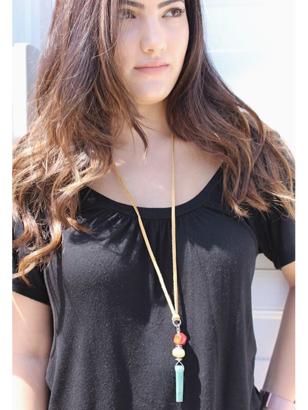 long beaded leather necklace on model with black top